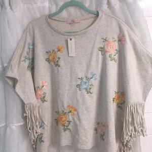 to brand fringe side embroidered tunic.